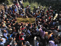 People carry the dead body of Doctor Shahnawaz Ahmad Dar during his funeral ceremony at his native village in Nadigam in central Kashmir's B...