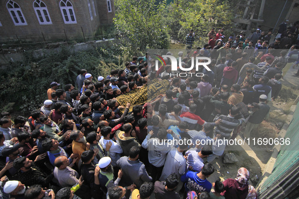 People carry the dead body of Doctor Shahnawaz Ahmad Dar during his funeral ceremony at his native village in Nadigam in central Kashmir's B...