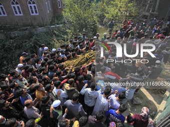 People carry the dead body of Doctor Shahnawaz Ahmad Dar during his funeral ceremony at his native village in Nadigam in central Kashmir's B...