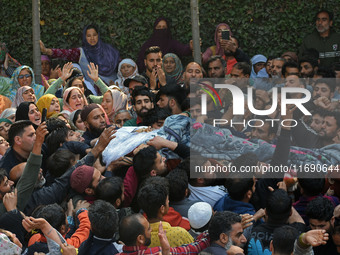 People carry the dead body of Doctor Shahnawaz Ahmad Dar during his funeral ceremony at his native village in Nadigam in central Kashmir's B...