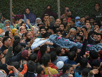 People carry the dead body of Doctor Shahnawaz Ahmad Dar during his funeral ceremony at his native village in Nadigam in central Kashmir's B...