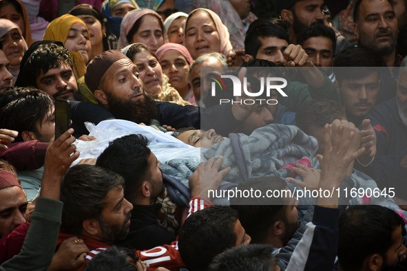 People carry the dead body of Doctor Shahnawaz Ahmad Dar during his funeral ceremony at his native village in Nadigam in central Kashmir's B...