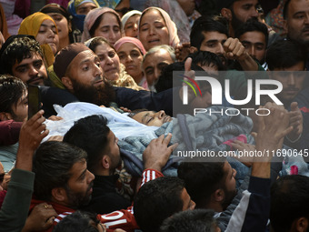 People carry the dead body of Doctor Shahnawaz Ahmad Dar during his funeral ceremony at his native village in Nadigam in central Kashmir's B...