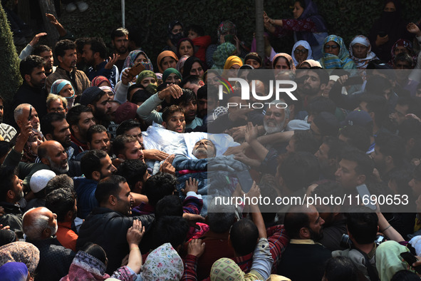 People carry the dead body of Doctor Shahnawaz Ahmad Dar during his funeral ceremony at his native village in Nadigam in central Kashmir's B...