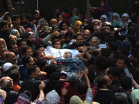 People carry the dead body of Doctor Shahnawaz Ahmad Dar during his funeral ceremony at his native village in Nadigam in central Kashmir's B...