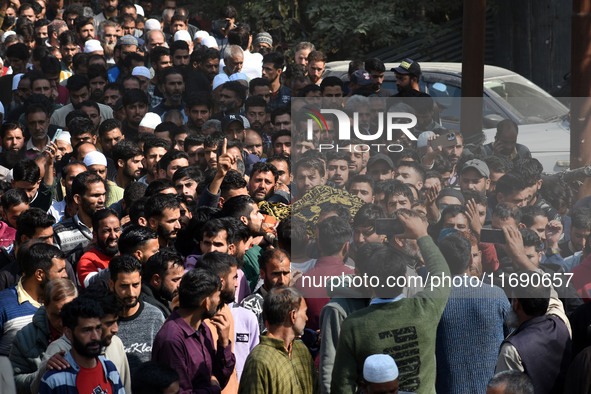 People carry the dead body of Doctor Shahnawaz Ahmad Dar during his funeral ceremony at his native village in Nadigam in central Kashmir's B...