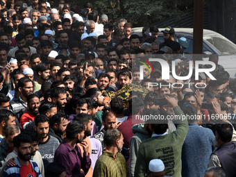 People carry the dead body of Doctor Shahnawaz Ahmad Dar during his funeral ceremony at his native village in Nadigam in central Kashmir's B...