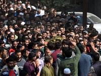 People carry the dead body of Doctor Shahnawaz Ahmad Dar during his funeral ceremony at his native village in Nadigam in central Kashmir's B...