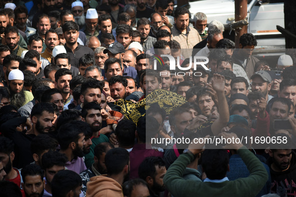 People carry the dead body of Doctor Shahnawaz Ahmad Dar during his funeral ceremony at his native village in Nadigam in central Kashmir's B...