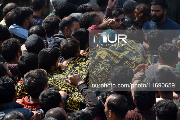 People carry the dead body of Doctor Shahnawaz Ahmad Dar during his funeral ceremony at his native village in Nadigam in central Kashmir's B...