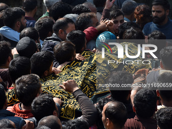 People carry the dead body of Doctor Shahnawaz Ahmad Dar during his funeral ceremony at his native village in Nadigam in central Kashmir's B...