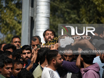 People carry the dead body of Doctor Shahnawaz Ahmad Dar during his funeral ceremony at his native village in Nadigam in central Kashmir's B...