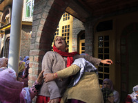 In Budgam, Kashmir, India, on October 21, 2024, a sister mourns over the dead body of Doctor Shahnawaz Ahmad Dar during his funeral ceremony...