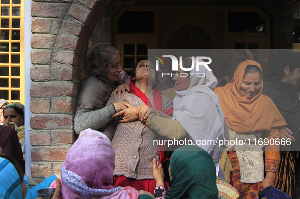 In Budgam, Kashmir, India, on October 21, 2024, a sister mourns over the dead body of Doctor Shahnawaz Ahmad Dar during his funeral ceremony...