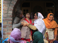 In Budgam, Kashmir, India, on October 21, 2024, a sister mourns over the dead body of Doctor Shahnawaz Ahmad Dar during his funeral ceremony...