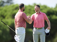 Jon Rahm of Spain greets Jacques Kruyswijk of South Africa at the end of day four of the Estrella Damm N.A. Andalucia Masters 2024 at Real C...