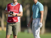 Johannes Veerman of the USA talks with his caddie on the 2nd hole during day four of the Estrella Damm N.A. Andalucia Masters 2024 at Real C...