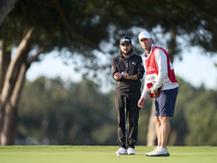 Angel Hidalgo of Spain talks with his caddie on the 1st green during day four of the Estrella Damm N.A. Andalucia Masters 2024 at Real Club...