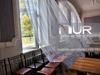 Curtains fly in a room damaged by the October 18 Russian missile strike in Odesa, Ukraine, on October 19, 2024. NO USE RUSSIA. NO USE BELARU...