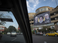 A banner featuring portraits of the IRGC's Quds Force former commander, General Qassem Soleimani, Lebanon's Hezbollah late leader, Hassan Na...