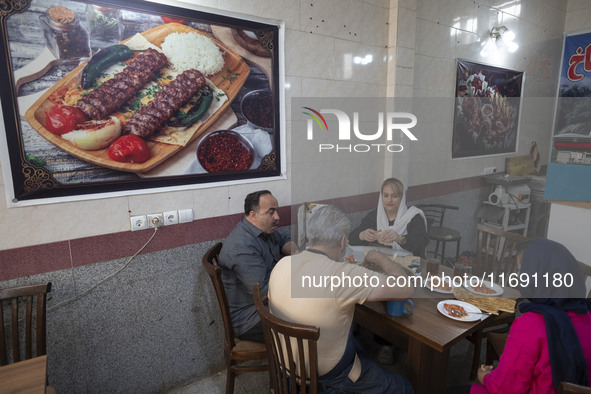 An Iranian family eats breakfast at a small restaurant in the historical city of Tabriz, located 624 km (388 miles) northwest of Tehran in t...