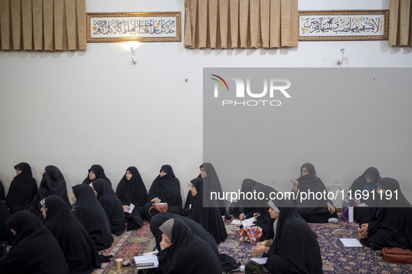 Veiled Iranian women in black chadors participate in an Islamic psychology class held at a mosque in the historical city of Tabriz, Iran, on...