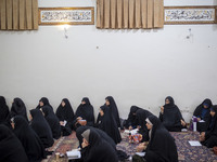 Veiled Iranian women in black chadors participate in an Islamic psychology class held at a mosque in the historical city of Tabriz, Iran, on...