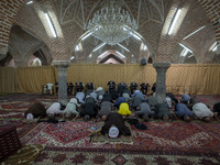 Iranian worshippers pray at a mosque in the historical city of Tabriz, located 624 km (388 miles) northwest of Tehran in the Eastern Azerbai...