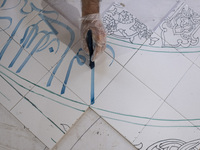 An Iranian artist works at a ceramic tile workshop in the suburb of the historical city of Tabriz, located 624 km (388 miles) northwest of T...