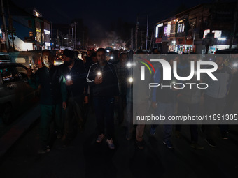 People from all walks of life protest against recent targeted killings of Indian laborers working in Ganderbal amid tight security in Baramu...