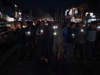 People from all walks of life protest against recent targeted killings of Indian laborers working in Ganderbal amid tight security in Baramu...