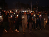 People from all walks of life protest against recent targeted killings of Indian laborers working in Ganderbal amid tight security in Baramu...