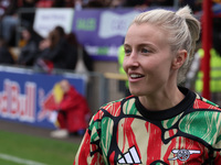 Leah Williamson of Arsenal participates in the pre-match warm-up during the Barclays FA Women's Super League soccer match between West Ham U...