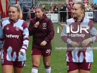 In Dagenham, England, on October 20, 2024, Kirsty Smith, Soraya Walsh, and Maria Bergman Lundin of West Ham United WFC participate in the pr...