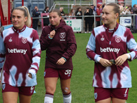 In Dagenham, England, on October 20, 2024, Kirsty Smith, Soraya Walsh, and Maria Bergman Lundin of West Ham United WFC participate in the pr...