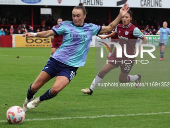 Caitlin Foord of Arsenal takes on Lime Mengwen of West Ham United WFC during the Barclays FA Women's Super League soccer match between West...