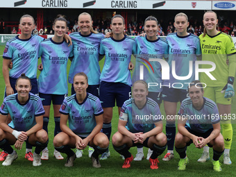 In Dagenham, England, on October 20, 2024, the Arsenal team lines up prior to kick-off. In the back row are Katie McCabe, Emily Fox, Frida M...