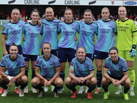 In Dagenham, England, on October 20, 2024, the Arsenal team lines up prior to kick-off. In the back row are Katie McCabe, Emily Fox, Frida M...