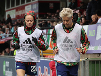 In Dagenham, England, on October 20, 2024, Kathrine Moller Kuhl of Arsenal and Lina Hurtig of Arsenal participate in the Barclays FA Women's...