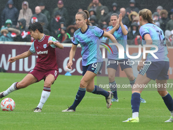 Riko Ueki of West Ham United WFC and Lia Walti of Arsenal are in action during the Barclays FA Women's Super League soccer match between Wes...