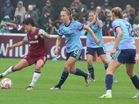 Riko Ueki of West Ham United WFC and Lia Walti of Arsenal are in action during the Barclays FA Women's Super League soccer match between Wes...