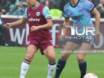 Riko Ueki of West Ham United WFC and Lia Walti of Arsenal are in action during the Barclays FA Women's Super League soccer match between Wes...