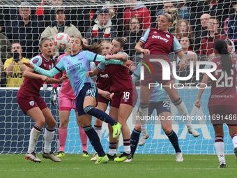 Rosa Kafaji of Arsenal (blue), Anouk Denton of West Ham United WFC, and Shelina Zadorsky of West Ham United WFC are in action during the Bar...