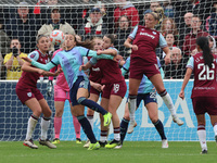 Rosa Kafaji of Arsenal (blue), Anouk Denton of West Ham United WFC, and Shelina Zadorsky of West Ham United WFC are in action during the Bar...