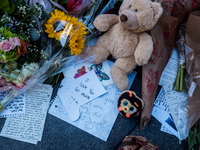 Flowers and cards are left at a memorial dedicated to former One Direction singer Liam Payne at Washington Square Park in New York, New York...