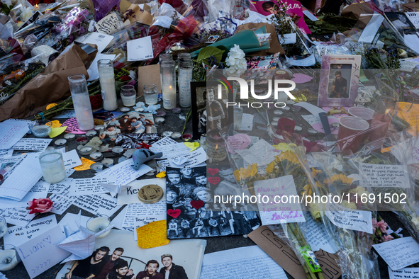 Flowers and cards are left at a memorial dedicated to former One Direction singer Liam Payne at Washington Square Park in New York, New York...