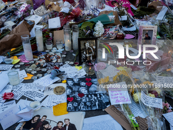 Flowers and cards are left at a memorial dedicated to former One Direction singer Liam Payne at Washington Square Park in New York, New York...