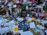 Flowers and cards are left at a memorial dedicated to former One Direction singer Liam Payne at Washington Square Park in New York, New York...