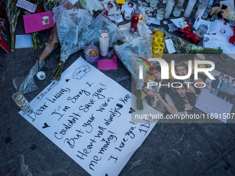 Flowers and cards are left at a memorial dedicated to former One Direction singer Liam Payne at Washington Square Park in New York, New York...