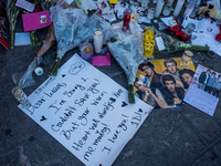 Flowers and cards are left at a memorial dedicated to former One Direction singer Liam Payne at Washington Square Park in New York, New York...